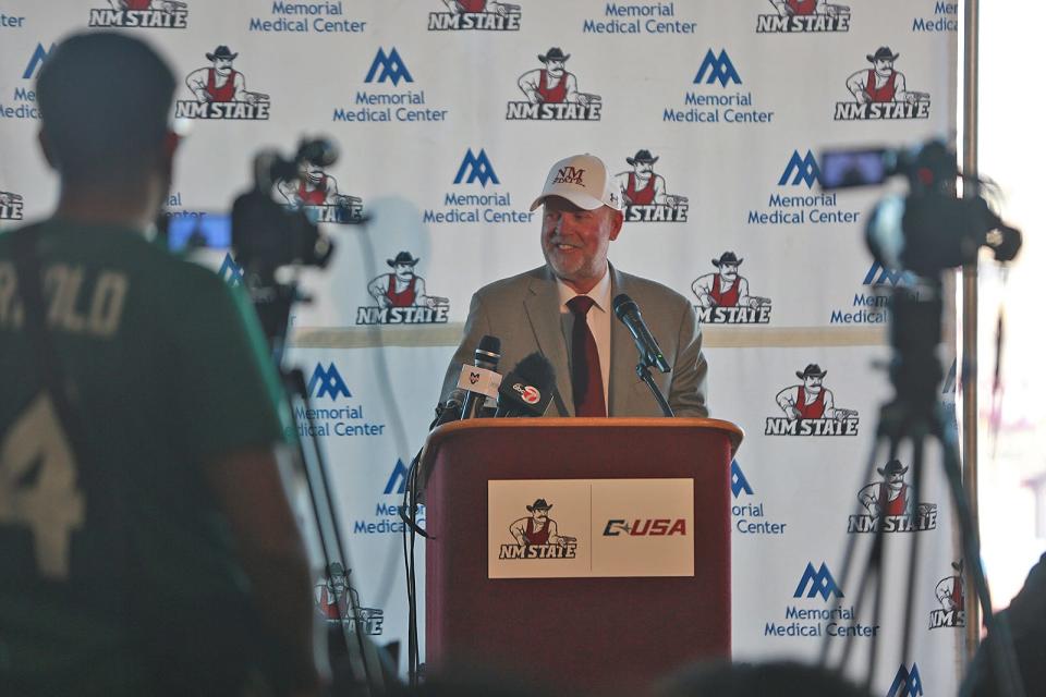 New Mexico State head football coach Jerry Kill looks to a table filled with NMSU players on Monday, Nov. 29, 2021, during a news conference to announce Kill's hire.