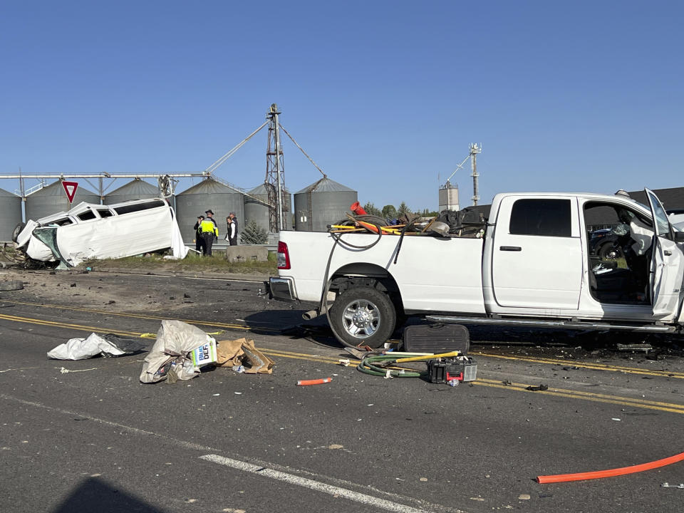 In this file photo provided by KIFI Local News 8, a pickup truck crashed into a passenger van on U.S. Highway 20, Saturday, May 18, 2024, in Idaho Falls, Idaho. The six people killed when a pickup crashed into a passenger van in Idaho over the weekend were agricultural workers from Mexico, officials said. (Jeff Roper/KIFI Local News 8 via AP, File)