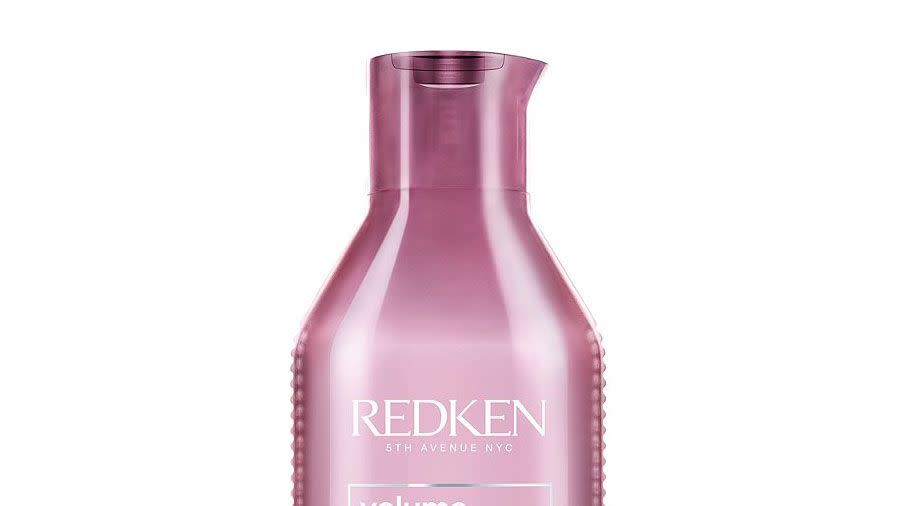 A bottle of Redken Volume Injection Shampoo