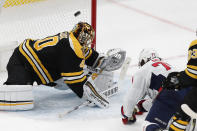 Washington Capitals' T.J. Oshie (77) scores on Boston Bruins' Tuukka Rask (40) during the first period of an NHL hockey game, Sunday, April 18, 2021, in Boston. (AP Photo/Michael Dwyer)