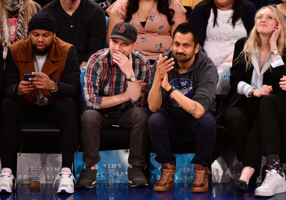 the two sitting court side at a basketball game