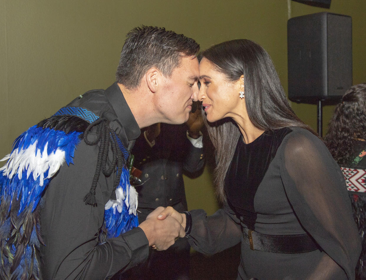 The Duchess of Sussex receives a Hongi, a traditional Maori greeting, as she attends the opening of Oceania at the Royal Academy of Arts in London (PA)