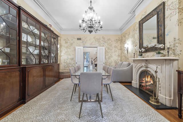 <p>concierge auctions</p> Sonja Morgan's home features a fireplace with a marble mantle