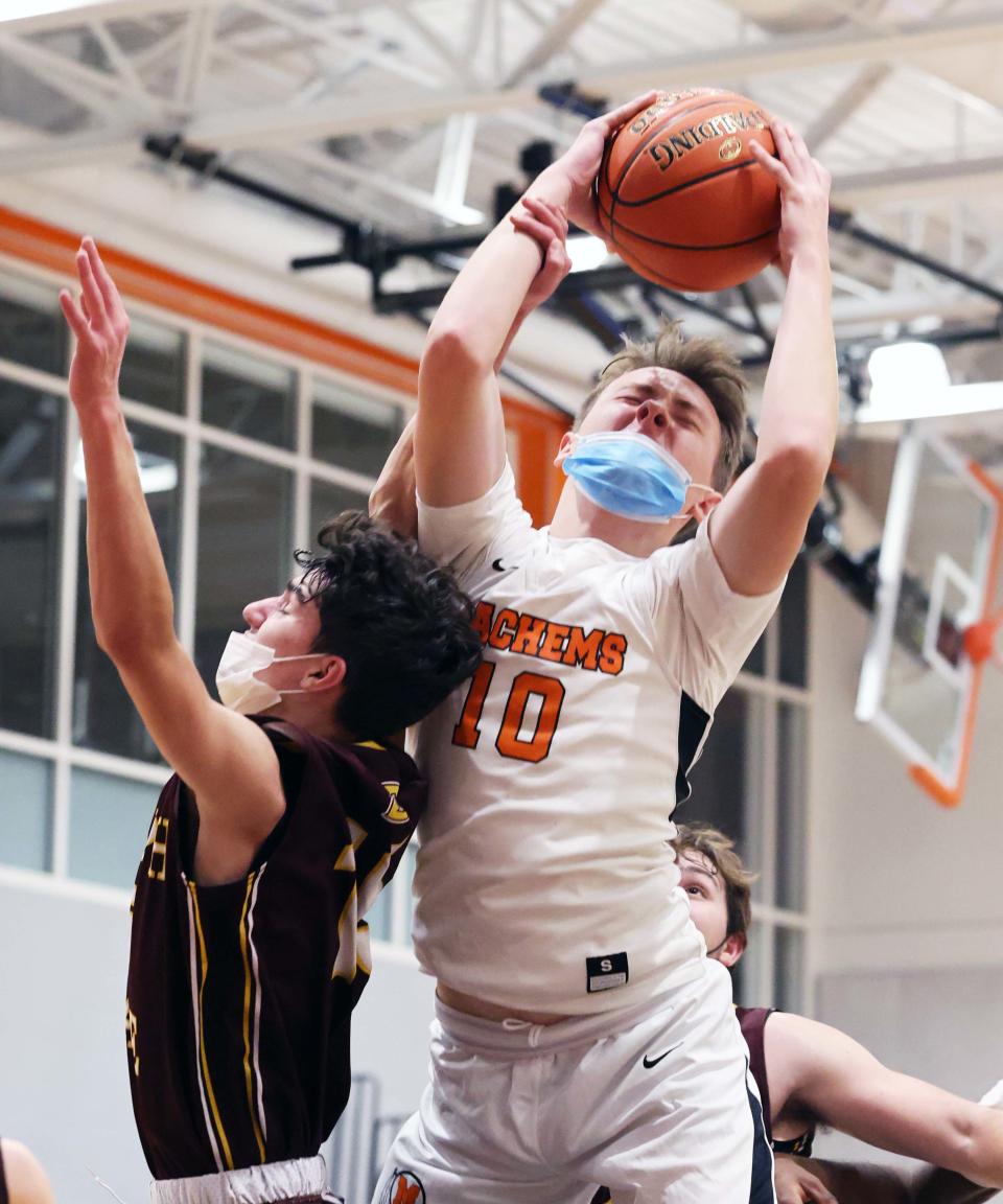 Middleboro's Jacob Briggs battles for a rebound with Case defender Hayden Cayton during a game on Friday, Dec. 10, 2021.