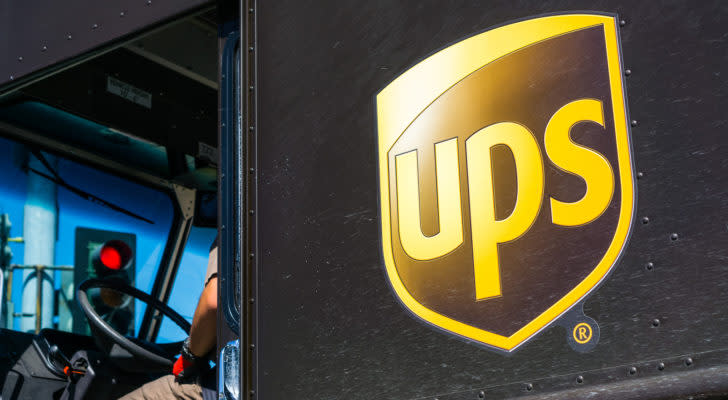 Dark brown delivery truck featuring the United Parcel Service (UPS) logo