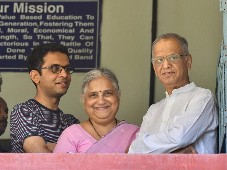 Infosys founder and mentor Narayana Murthy (right), his philanthropist wife Sidha Murthy (centre) and son Rohan Murthy (left) (AFP via Getty Images)