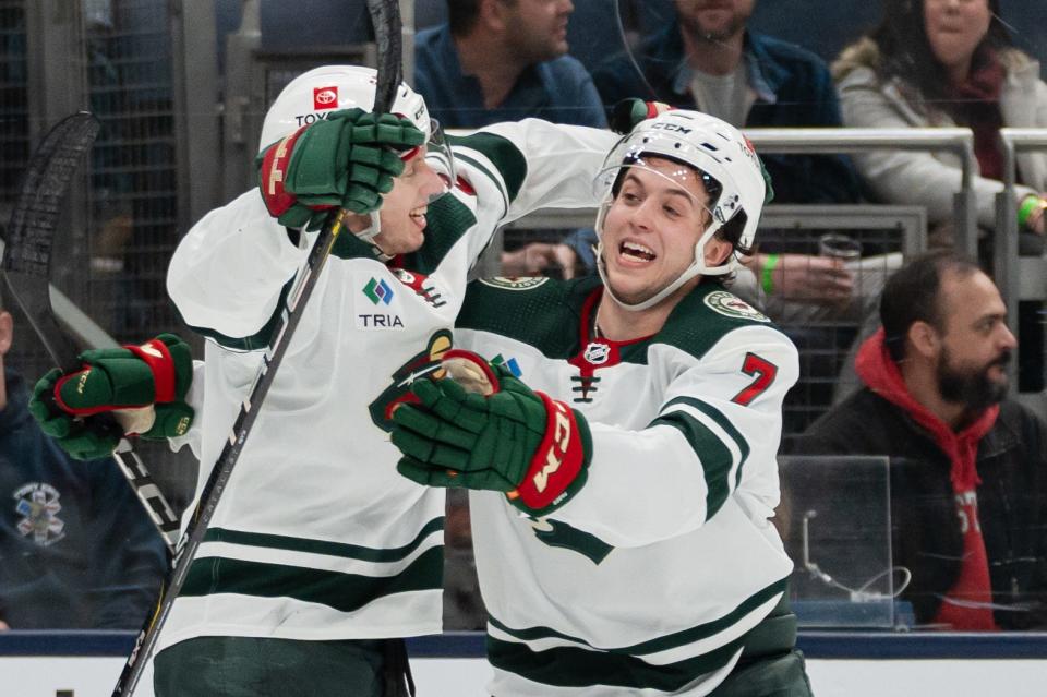 Jan 6, 2024; Columbus, Ohio, USA;
Minnesota Wild center Marco Rossi (23) celebrates his game winning goal with Brock Faber (7) during the overtime of their game against the Columbus Blue Jackets on Saturday, Jan. 6, 2024 at Nationwide Arena.