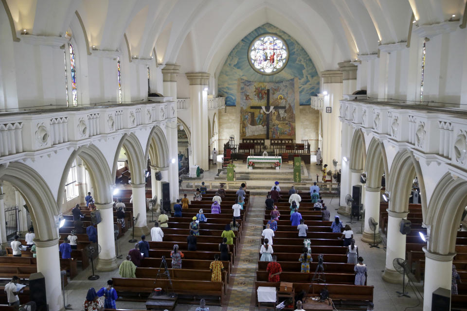 The congregation practises social-distancing to curb the spread of the coronavirus during a Sunday mass at the Holy Cross Cathedral in Lagos, Nigeria Sunday, Aug. 30, 2020. The COVID-19 pandemic is testing the patience of some religious leaders across Africa who worry they will lose followers, and funding, as restrictions on gatherings continue. (AP Photo/Sunday Alamba)