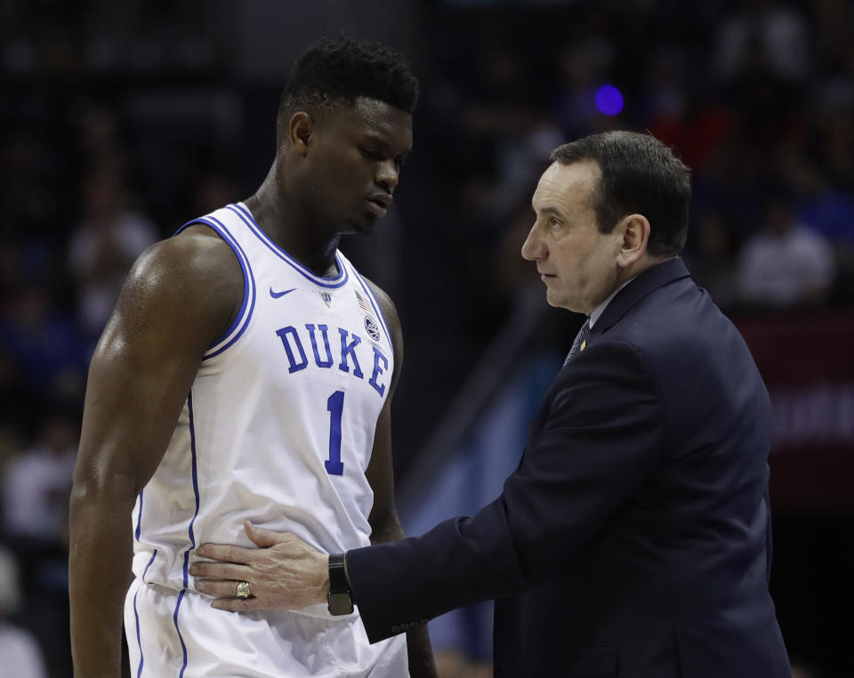 Duke head coach Mike Krzyzewski talks to Zion Williamson (1) during the first half of the NCAA college basketball championship game of the Atlantic Coast Conference tournament in Charlotte, N.C., Saturday, March 16, 2019. (AP Photo/Nell Redmond)