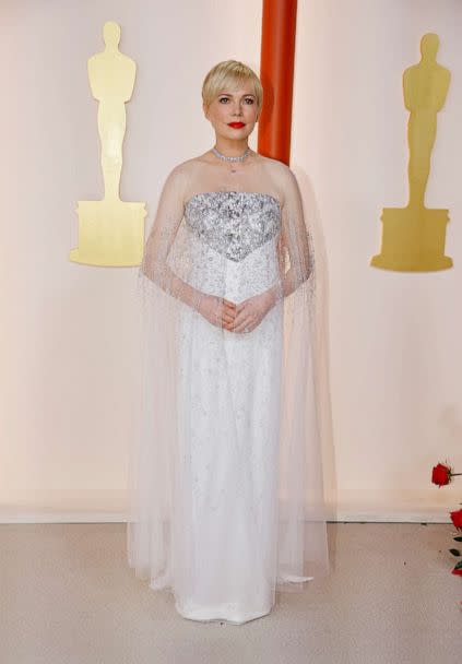 PHOTO: Michelle Williams poses on the champagne-colored red carpet during the Oscars arrivals at the 95th Academy Awards in Hollywood, Calif., March 12, 2023. (Eric Gaillard/Reuters)