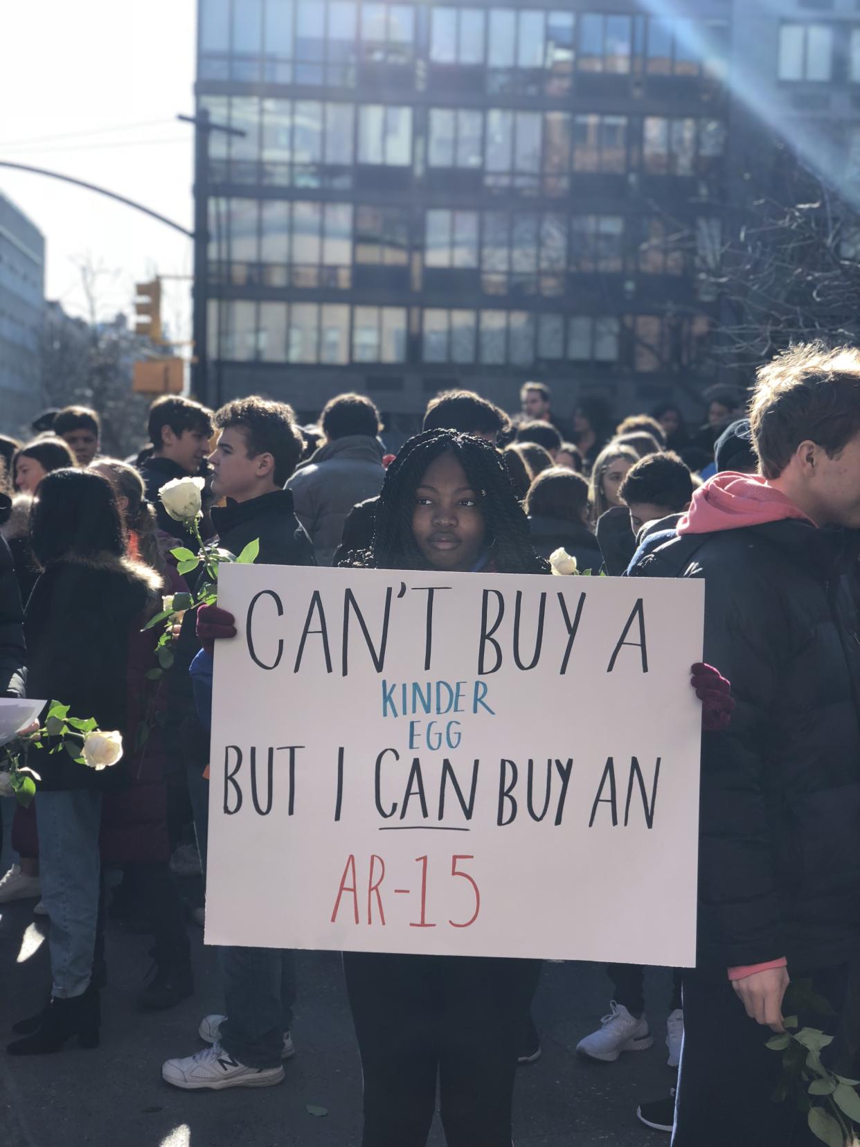 A student from Grace Church School in New York City holds a sign made for the day’s protests. (Photo: Alexandra Mondalek)