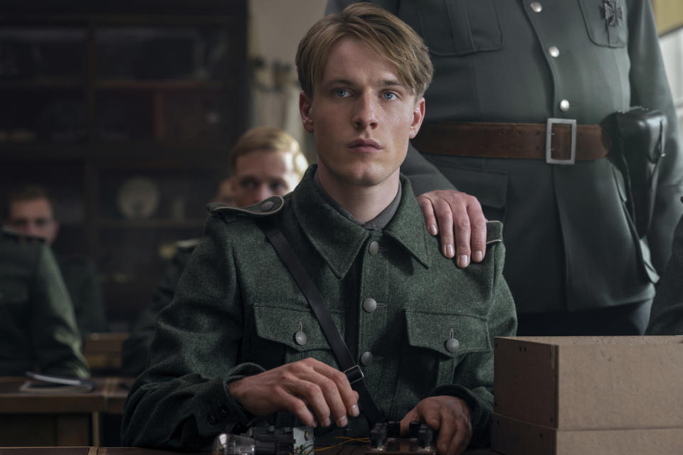 This image released by Netflix shows Louis Hofmann in a scene from "All the Light We Cannot See." (Katalin Vermes/Netflix via AP)