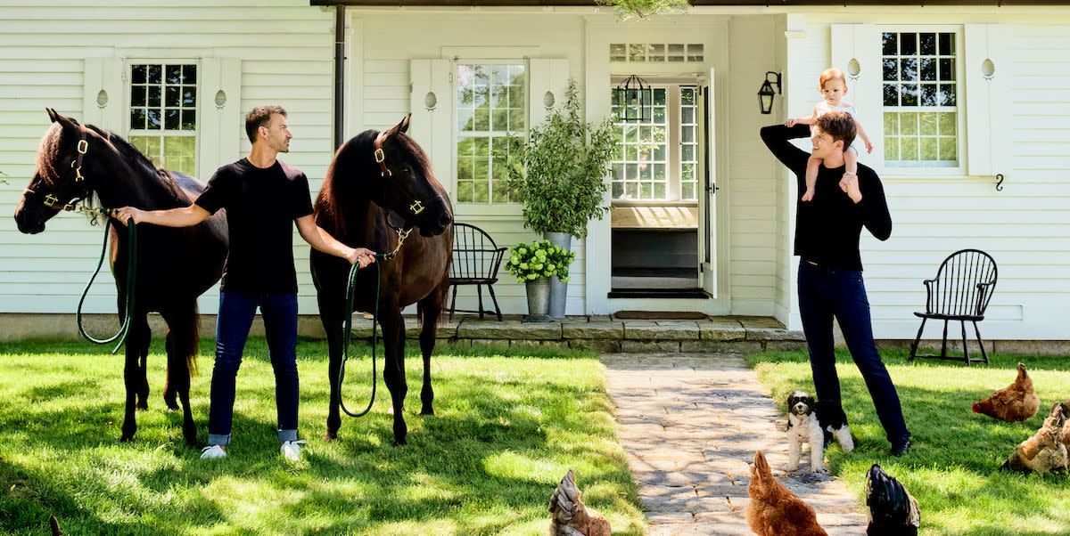 arnhold and gordon, holding the couple’s son, henry, look on amid the family’s horses and brood of chickens