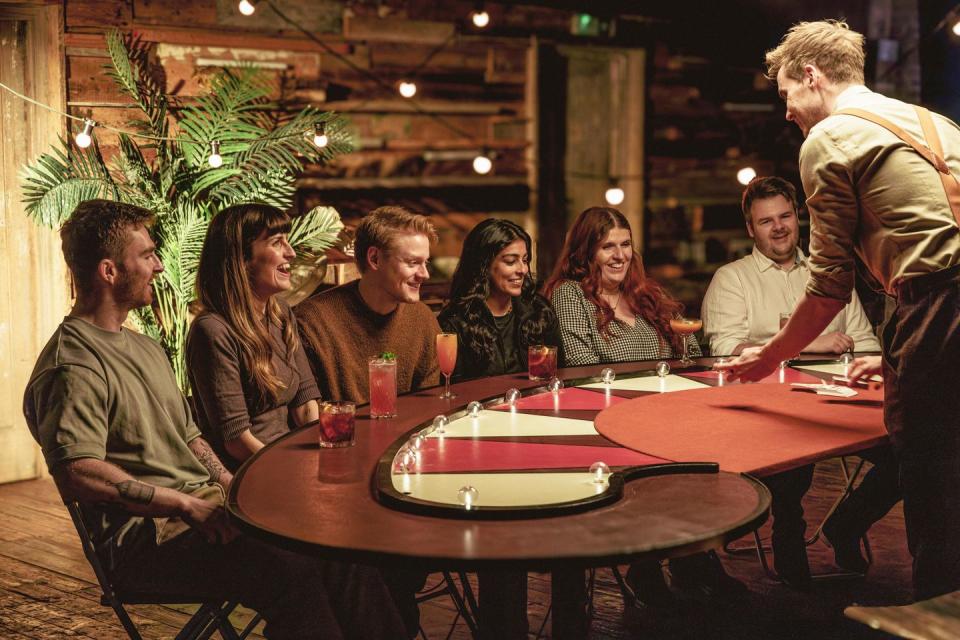 a group of people sitting around a table