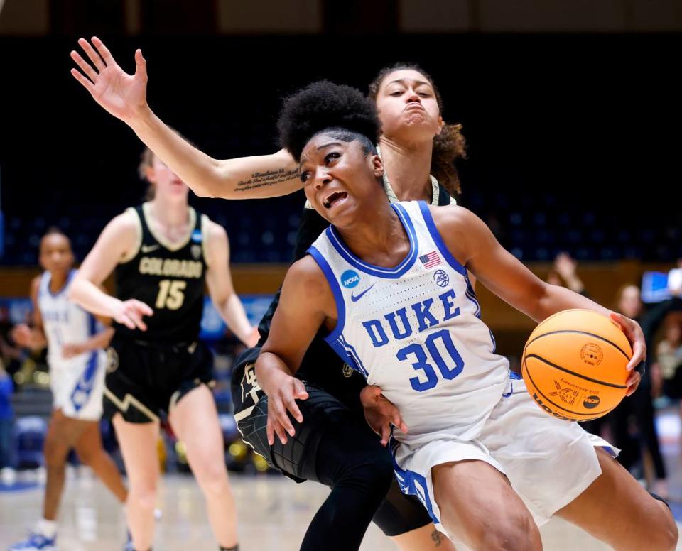 Duke’s Shayeann Day-Wilson drives past Colorado’s Tayanna Jones during the second half of the Blue Devils’ 61-53 loss to Colorado in an NCAA Tournament second round game at Cameron Indoor Stadium on Monday, March 20, 2023, in Durham, N.C.