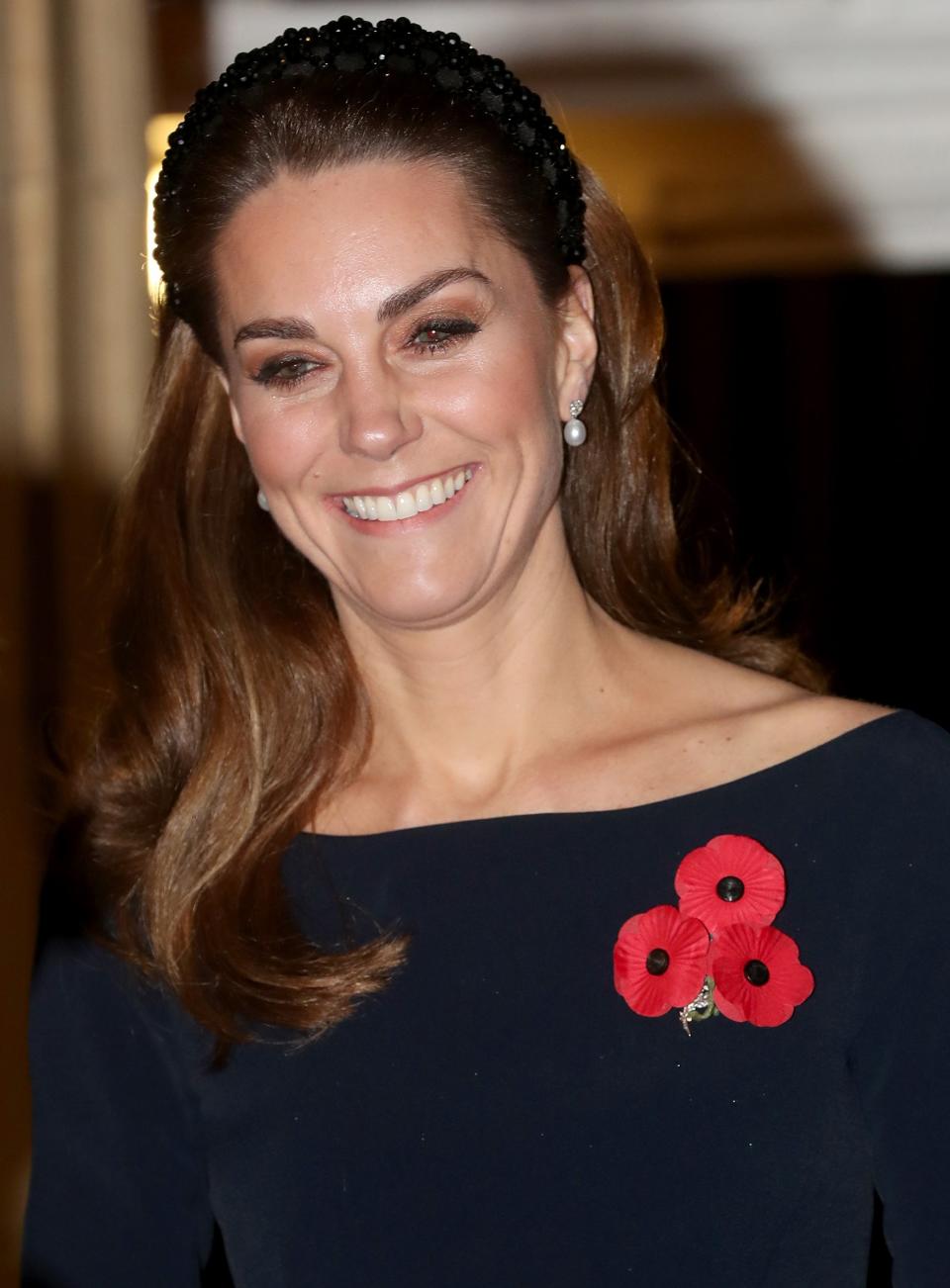 Meghan and Kate opted for similar looks for the occasion, both wearing black dresses adorned with a <a href="https://people.com/royals/why-the-royal-family-wears-red-poppy-pins-and-what-it-signifies/" rel="nofollow noopener" target="_blank" data-ylk="slk:red poppy pin;elm:context_link;itc:0;sec:content-canvas" class="link ">red poppy pin</a>, an artificial flower that has been used since 1921 to commemorate military members who have died in war.