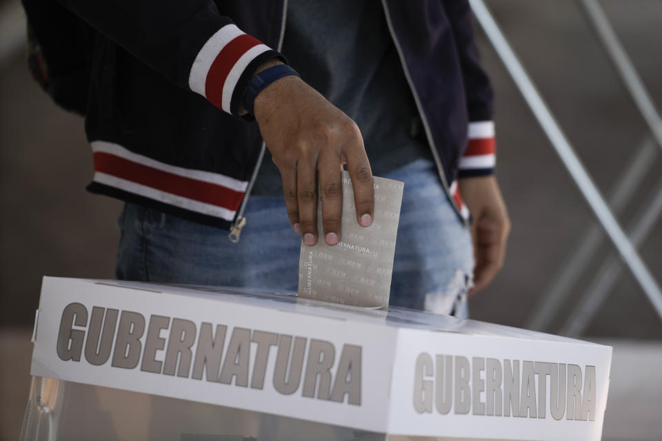 A man casts his ballot during the local state elections in Texcoco, Mexico state, Sunday, April 4, 2023. (AP Photo/Eduardo Verdugo)