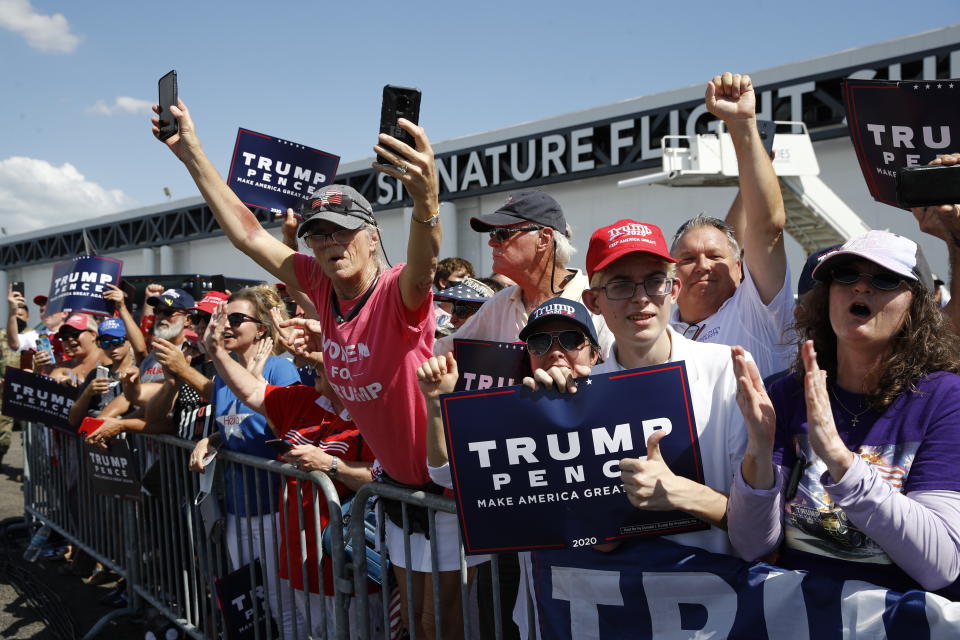 Supporters cheer as President Donald Trump speaks during a campaign event with Florida Sheriffs in Tampa, Fla., Friday, July 31, 2020. (AP Photo/Patrick Semansky)