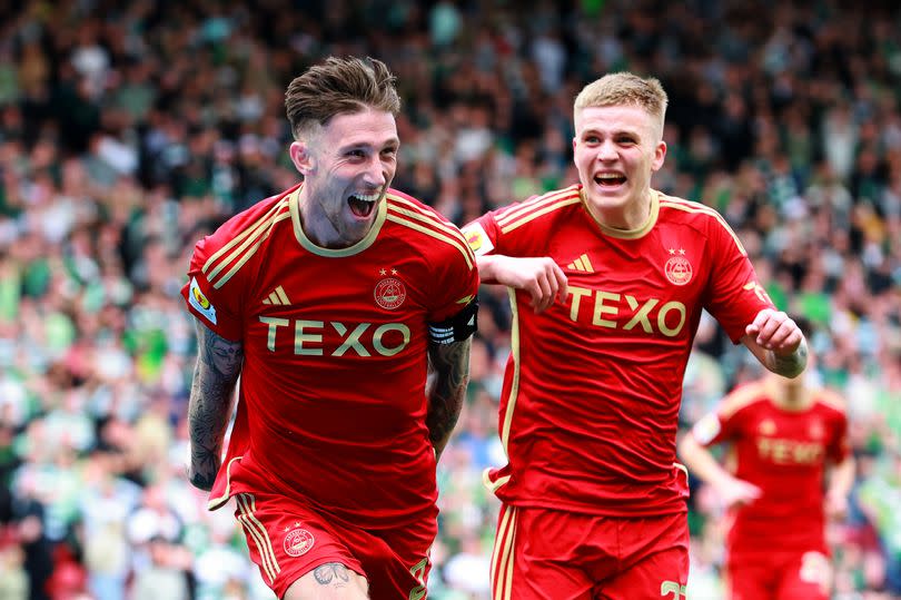 Angus MacDonald, left, celebrates his goal