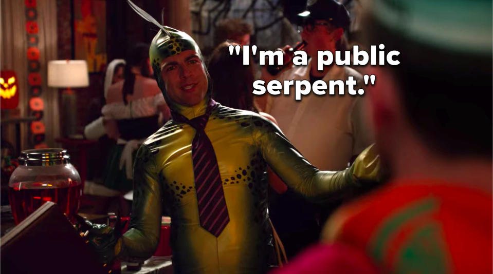 Schmidt is dressed up in a snake costume with a tie and a briefcase and he says, I'm a public serpent