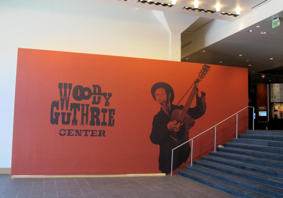 This April 25, 2013, photo shows the entrance to the Woody Guthrie Center, which opens to the public on Saturday in downtown Tulsa. The center features interactive exhibits chronicling the Oklahoma folk singer’s life and career, as well as an original, handwritten copy of “This Land is Your Land.” (AP Photo/Justin Juozapavicius)