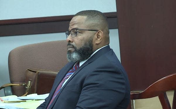 Former Clay County Sheriff Darryl Daniels sits at the defense attorney's table early Tuesday as the jury in his criminal trial begins with testimony from his former mistress.