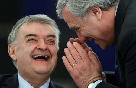 European Parliament's presidential candidate Antonio Tajani (R) jokes with Parliament member Herbert Reul as they attend the election of the new President of the European Parliament in Strasbourg, France January 17, 2017. REUTERS/Christian Hartmann