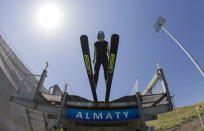 A skier jumps during training session at the Sunkar Ski Jumping complex in Almaty, Kazakhstan, July 15, 2015. REUTERS/Shamil Zhumatov