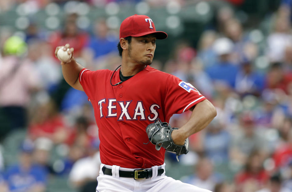 Texas Rangers starting pitcher Yu Darvish, of Japan, works against the Boston Red Sox in the first inning of a baseball game, Friday, May 9, 2014, in Arlington, Texas. (AP Photo/Tony Gutierrez)