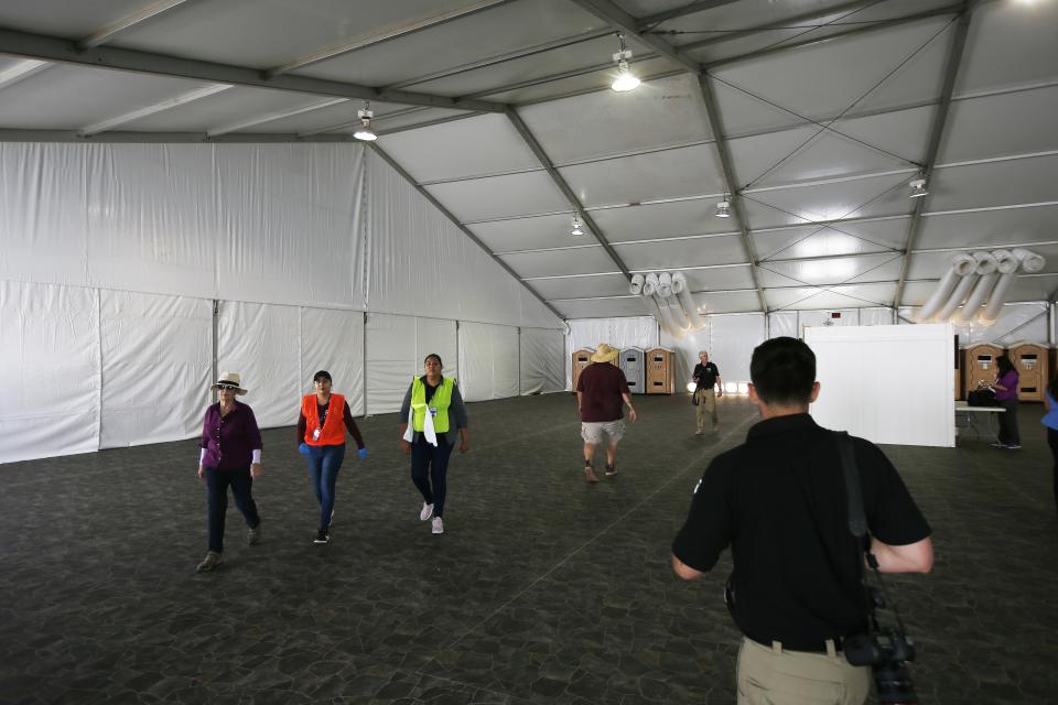 U.S. Border Patrol unveiled a new 500-person tent facility during a media tour Friday, June 28, 2019, in Yuma, Ariz. The facility will be used to process detained immigrant children and families who cross the U.S. border. The Border Patrol says it will start placing families there on Friday night. (AP Photo/Ross D. Franklin)