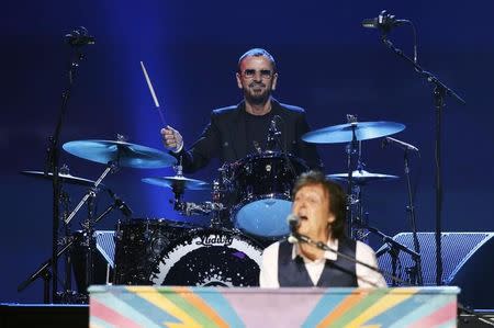 Paul McCartney (Front) and Ringo Starr perform during the taping of "The Night That Changed America: A GRAMMY Salute To The Beatles", which commemorates the 50th anniversary of The Beatles appearance on the Ed Sullivan Show, in Los Angeles January 27, 2014. REUTERS/Mario Anzuoni