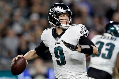 Philadelphia Eagles quarterback Nick Foles passes against the Los Angeles Rams during the second half of an NFL football game in Los Angeles. The Philadelphia Eagles are again counting on Super Bowl MVP Foles to win high-stakes games - Credit: AP Photo/Marcio Jose Sanchez