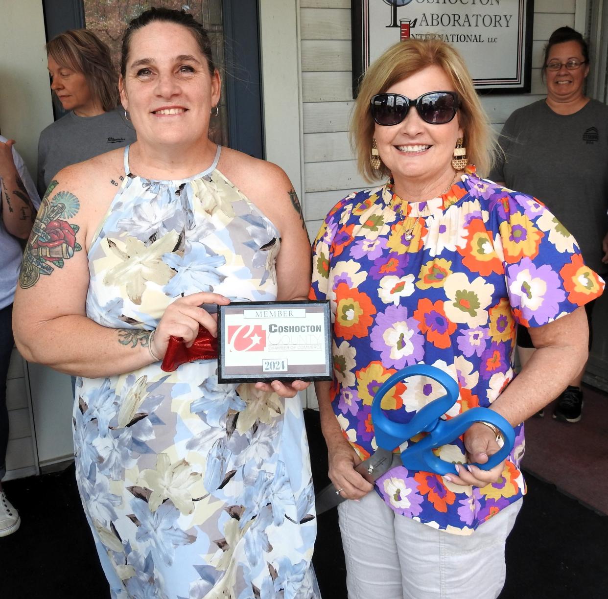 Kitt Silva of Silva Linings Cheesecakery with Amy Crown of the Coshocton County Chamber of Commerce. A ribbon cutting was held for the new cooperative of several local bakers.