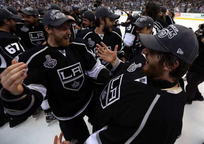 LOS ANGELES, CA - JUNE 11: Trevor Lewis #22 (L) and goaltender Jonathan Quick #32 of the Los Angeles Kings celebrate after the Kings defeated the New Jersey Devils 6-1 to win the Stanley Cup series 4-2 in Game Six of the 2012 Stanley Cup Final at Staples Center on June 11, 2012 in Los Angeles, California. (Photo by Bruce Bennett/Getty Images)