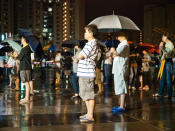Rallygoers were sparsely packed in the big field because of the poor turnout. (Yahoo! photo/Alvin Ho)