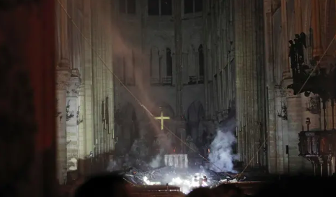 Smoke rises from ground inside the towers. Source: AP