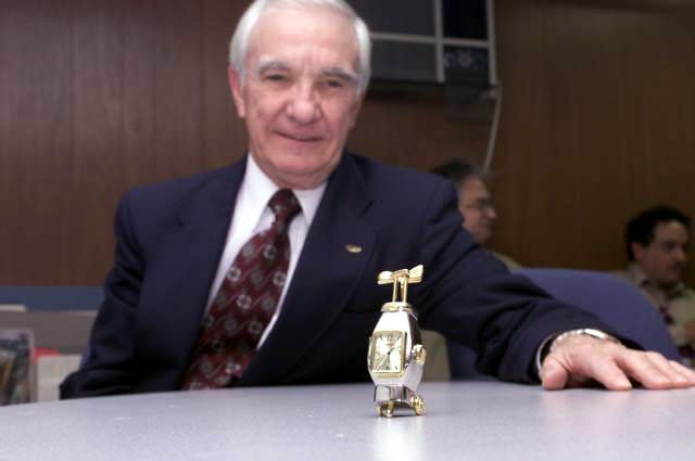 Joe Tracy receives a watch at his 1999 retirement party. He continued to work at ORNL part-time until his death last week.