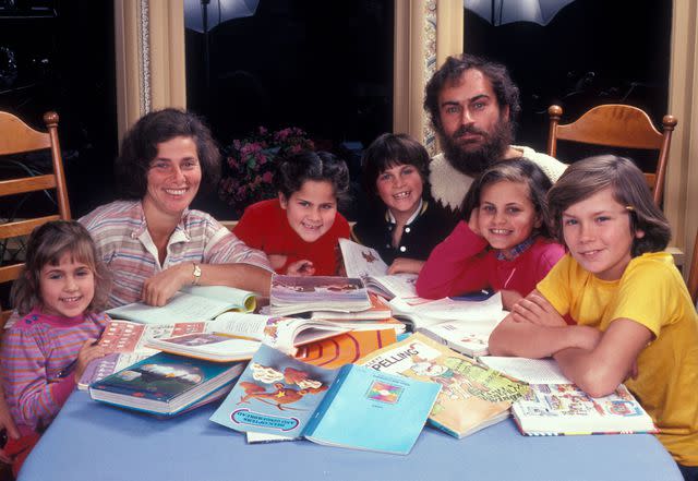 <p>Dianna Whitley/Getty</p> Summer Phoenix, Arlyn Phoenix, Rain Phoenix, Joaquin Phoenix, John Phoenix, Liberty Phoenix and River Phoenix at home in Los Angeles, California, circa 1983.