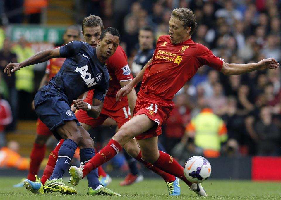 Liverpool's Lucas challenges Manchester United's Nani during their English Premier League soccer match at Anfield, Liverpool