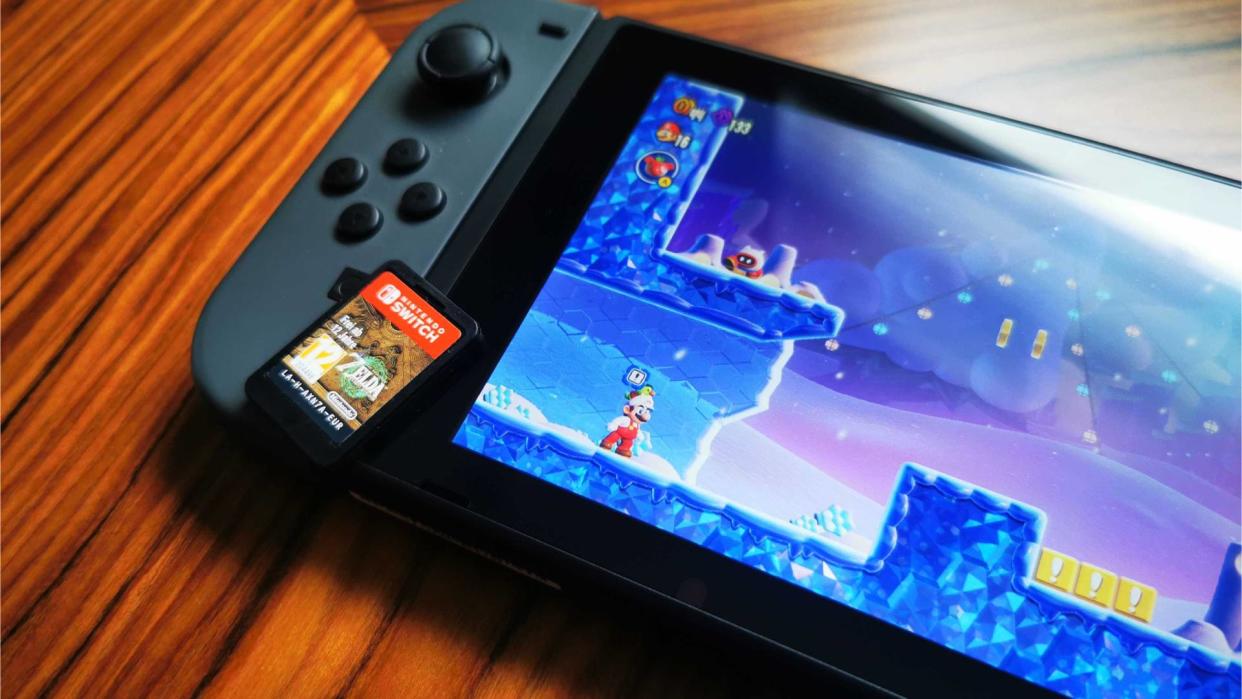  Nintendo Switch with Super Mario Wonder on screen. 
