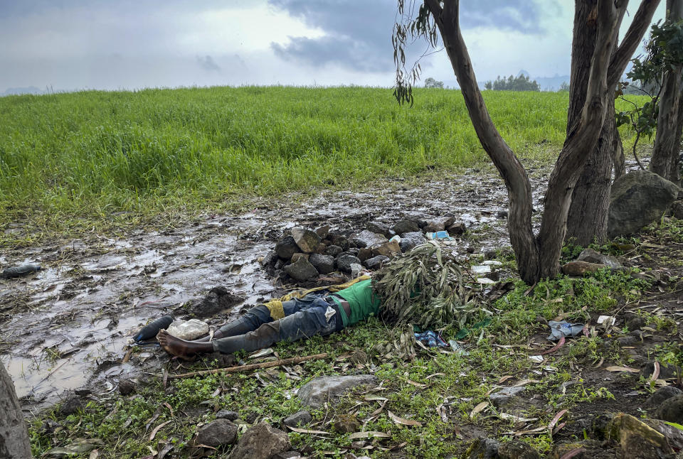 FILE - The dead body of an unidentified man lies on the ground near the village of Chenna Teklehaymanot, in the Amhara region of northern Ethiopia on Sept. 9, 2021. The war in Africa's second most populous country has killed thousands of people and displaced millions. (AP Photo/File)