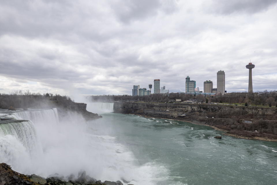 A view of Niagara Falls, Ontario, Canada, is shown on Friday, March 29, 2024 seen from Niagara Falls, N.Y. Ontario's Niagara Region has declared a state of emergency as it readies to welcome up to a million visitors for the solar eclipse on April 8. (Carlos Osorio/The Canadian Press via AP)