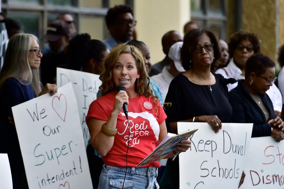 Katie Hathaway, one of the local leaders of Moms Demand Action, talks to supporters of Duval County schools Superintendent Diana Greene about her concern that Greene's job could be jeopardized by political machinations when the Duval Couty School Board meets Wednesday to discuss longstanding complaints about teacher miscinduct at Douglas Anderson School of the Arts.