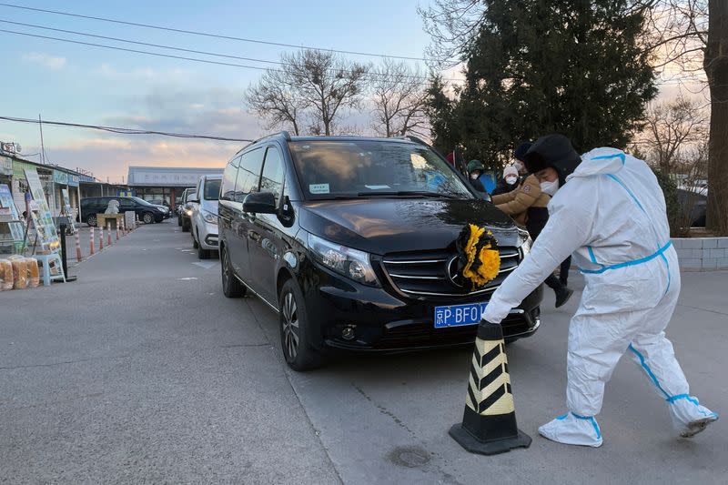 Hearses outside a funeral home in Beijing