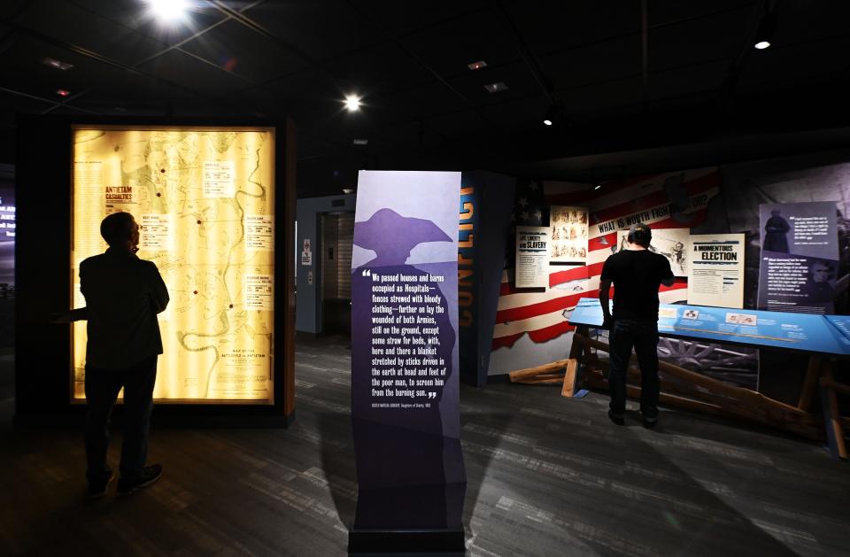 People look over maps and signage at the Antietam National Battlefield Visitor Center near Sharpsburg recently.