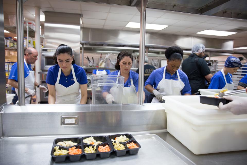 Volunteers prepare meals for delivery at Project Angel Food in Los Angeles. The photo was taken after a press conference on May 4, 2018, announcing the beginning of a pilot program to deliver low-sodium meals to people with congestive heart failure in Los Angeles county. (Photo: LA Care Health Plan)