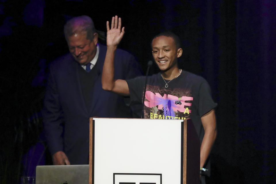 Actor and singer Jaden Smith waves to the crowd as he joins former Vice President Al Gore, left, during Gore's talk on climate change at Vanderbilt University as part of a worldwide event called 24 Hours of Reality: Truth in Action on Wednesday, Nov. 20, 2019, in Nashville, Tenn. (AP Photo/Mark Humphrey)