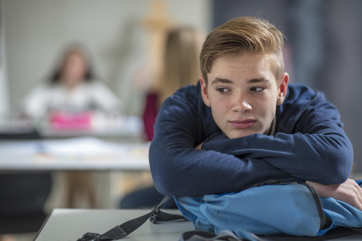 Unhappy boy at school. (Getty Images)