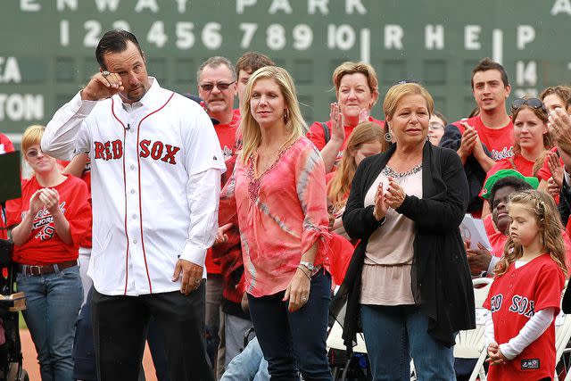 <p>Matthew West/MediaNews Group/Boston Herald via Getty</p> During a pre game ceremonyy honoring the knuckleballer, Tim Wakefield, flanked by his wife Stacy and his family, wipes a tear from his eye at Fenway Park on Tuesday, May 15, 2012. Staff Photo by Matthew West.