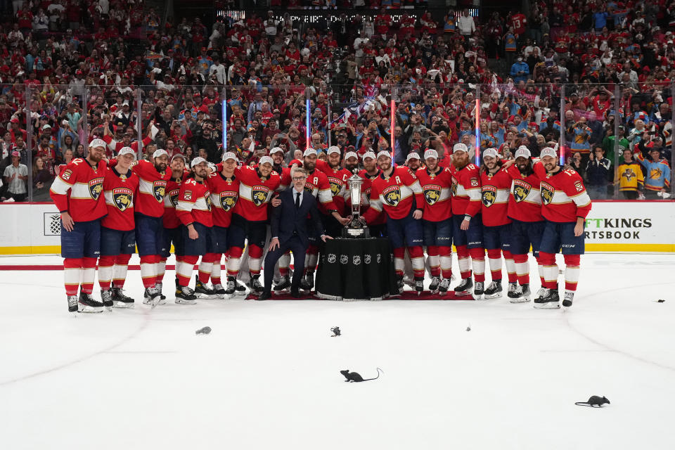 May 24, 2023; Sunrise, Florida, USA; Florida Panthers teammates pose for a photo with NHL senior executive vice president & chief branding officer Brian Jennings and the Prince of Wales trophy after defeating the Carolina Hurricanes in game four of the Eastern Conference Finals of the 2023 Stanley Cup Playoffs at FLA Live Arena. Mandatory Credit: Jasen Vinlove-USA TODAY Sports